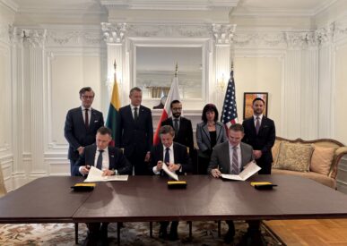 Representatives sign the memorandum during the official signing ceremony.