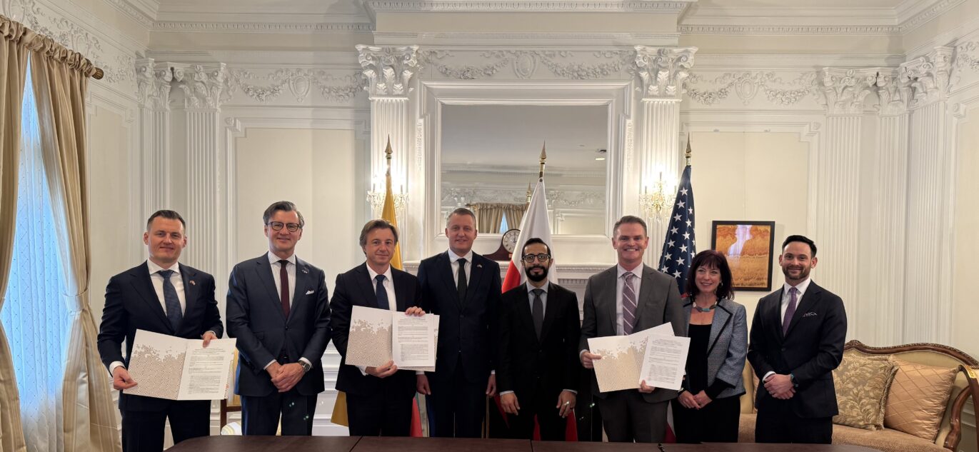 Participants of the memorandum signing ceremony present the signed documents after the official signing.